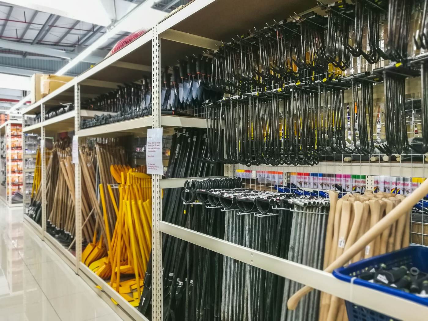 Construction and site tools stocked on warehouse shelving